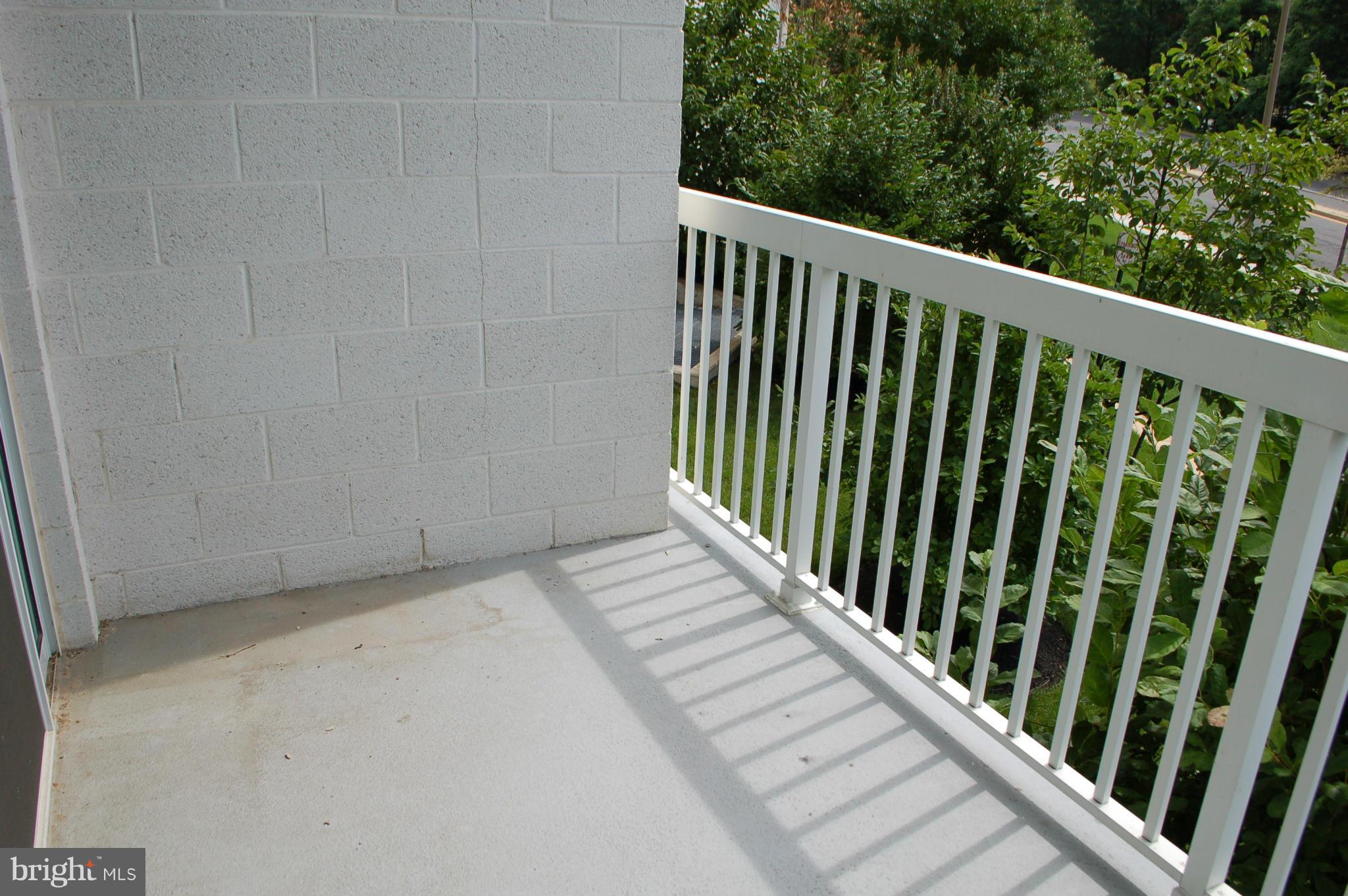 3101 North Hampton Drive, Unit 109 Alexandria, VA 22302 - Photo 6 of 10 a view of a balcony with wooden floor