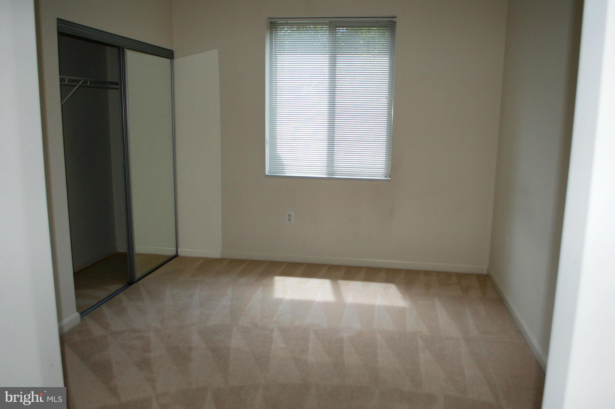 3101 North Hampton Drive, Unit 109 Alexandria, VA 22302 - Photo 7 of 10 an empty room with a window