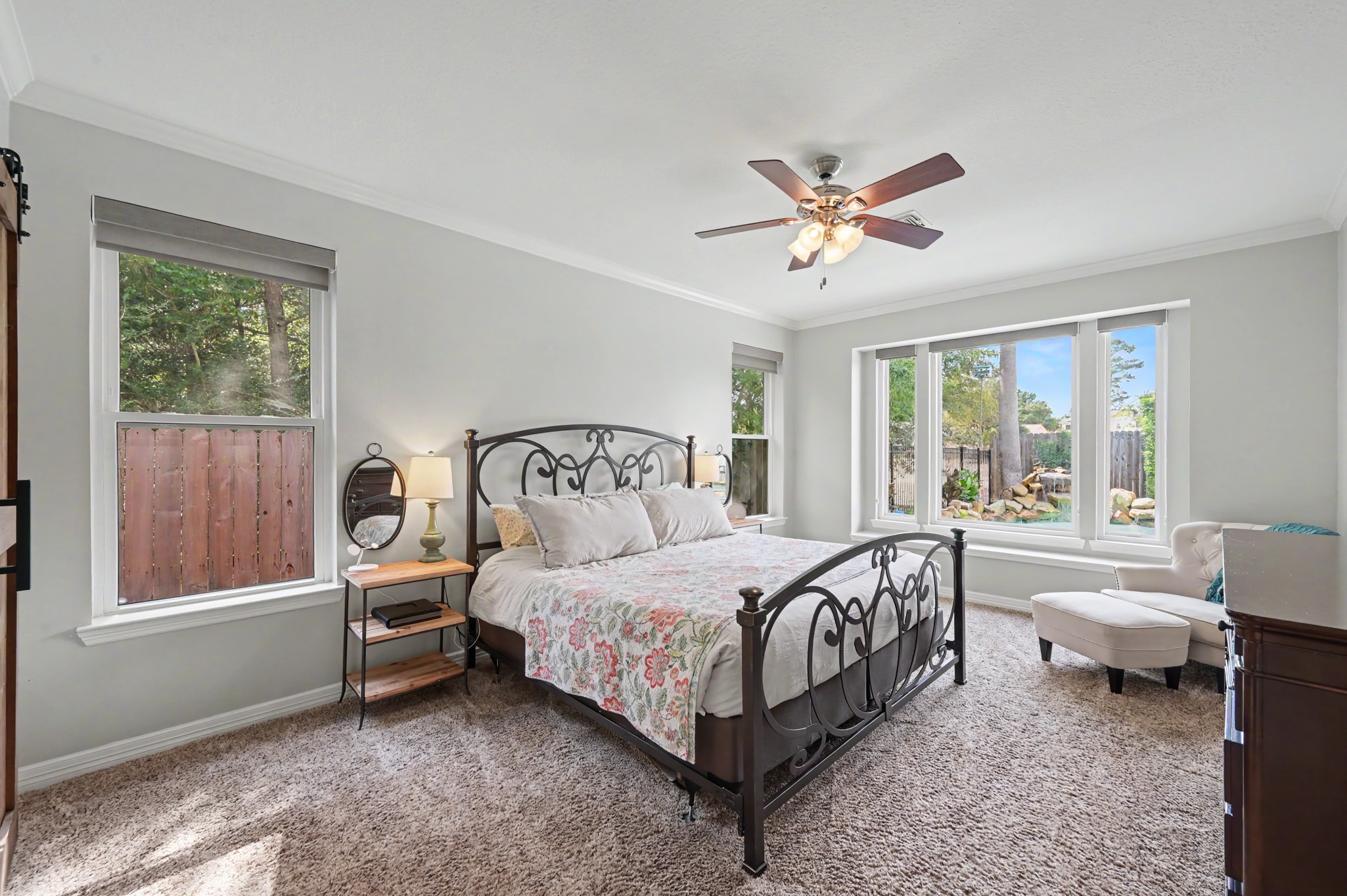 14938 Codys Run Cypress, TX 77429 - Photo 20 of 50 The primary suite has windows overlooking the side and back yard pool area. The shades were added in the bedroom which can be left open to enjoy the views or lowered for complete privacy.