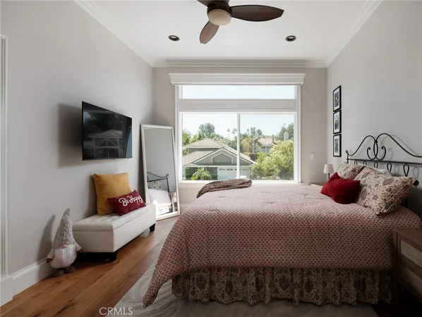 a bedroom with a bed and large window