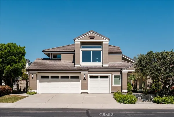 a front view of a house with a garage