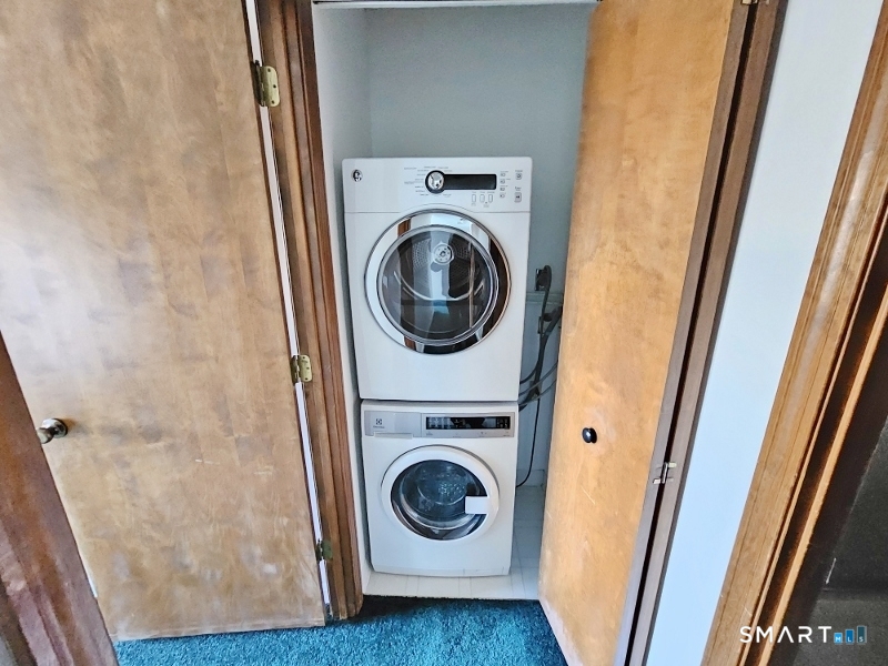 45 Putter Drive, Unit 509 Wallingford, CT 06492 - Photo 9 of 13 a utility room with dryer and washer