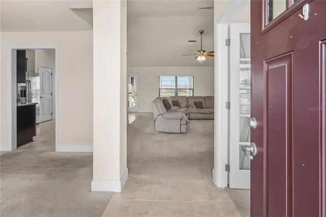 a living room with furniture and a view