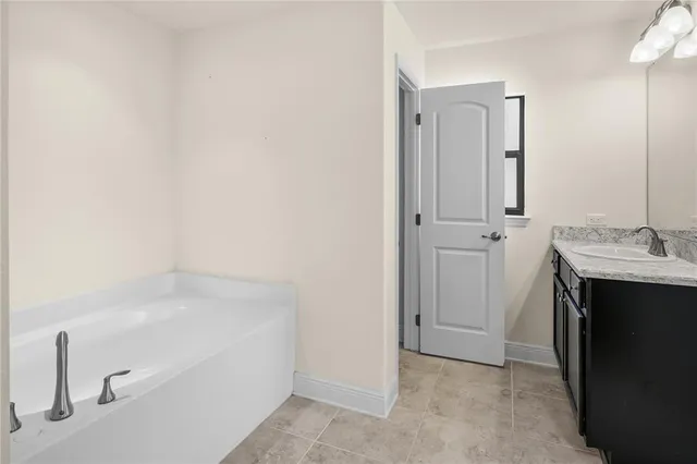 a kitchen with stainless steel appliances a refrigerator sink and microwave