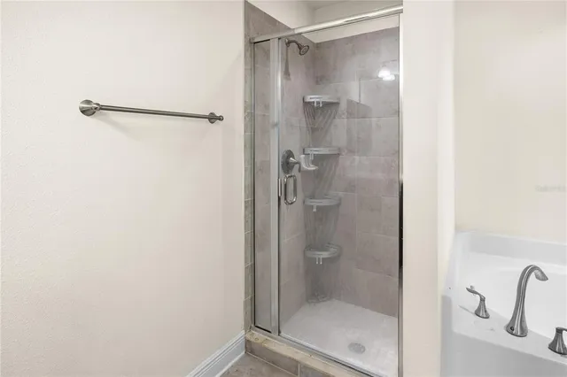 a kitchen with kitchen island stainless steel appliances a stove refrigerator and microwave