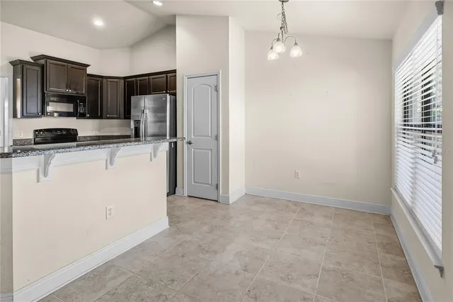 a bathroom with white cabinets