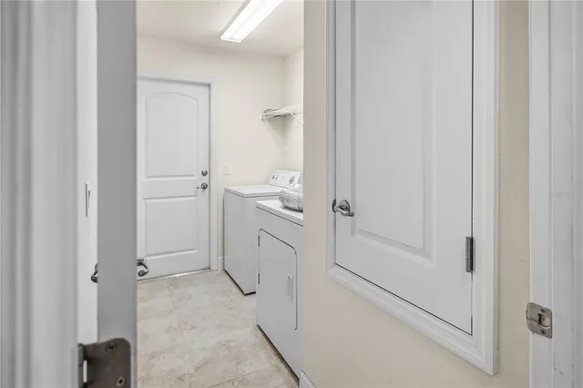 a white toilet sitting next to a shower