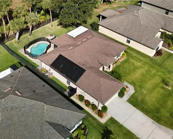 a view of a house with backyard porch and sitting area
