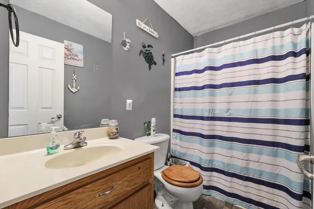 a bathroom with a sink and mirror