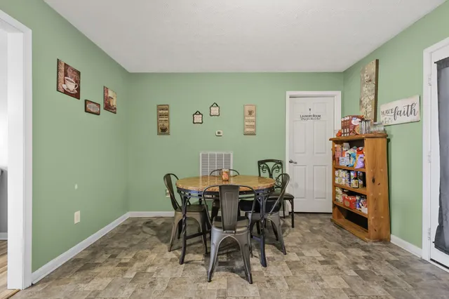 a view of a dining room with furniture