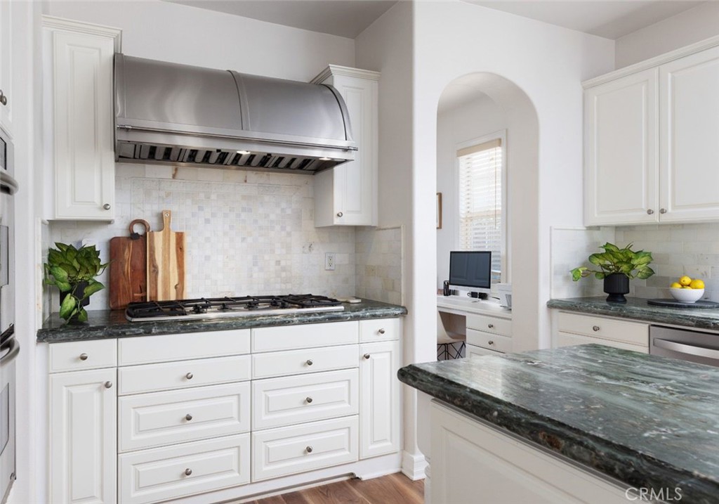 26 Via Fontibre San Clemente, CA 92673 - Photo 11 of 52 a kitchen with stainless steel appliances granite countertop a sink a stove and cabinets