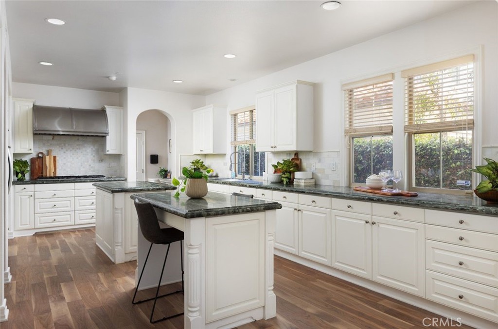 26 Via Fontibre San Clemente, CA 92673 - Photo 12 of 52 a kitchen with granite countertop white cabinets and white appliances