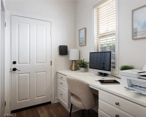 a kitchen with a appliances cabinets and a window