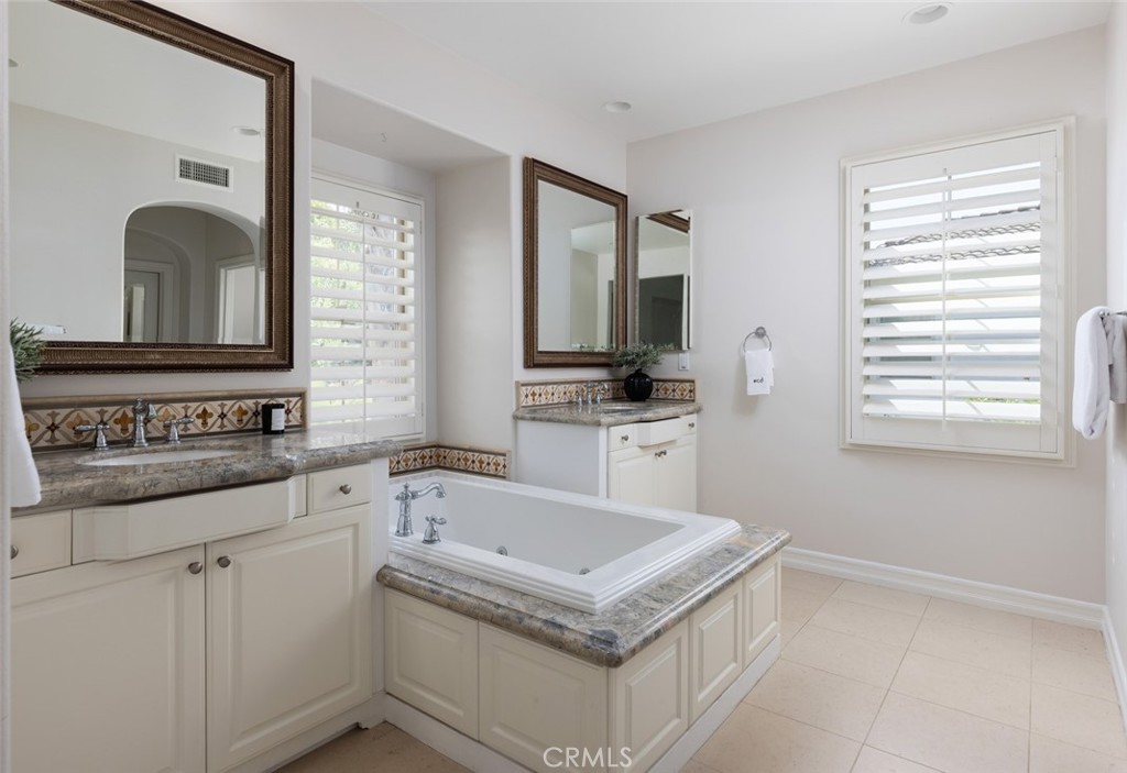 26 Via Fontibre San Clemente, CA 92673 - Photo 36 of 52 a kitchen with granite countertop a sink stove and cabinets