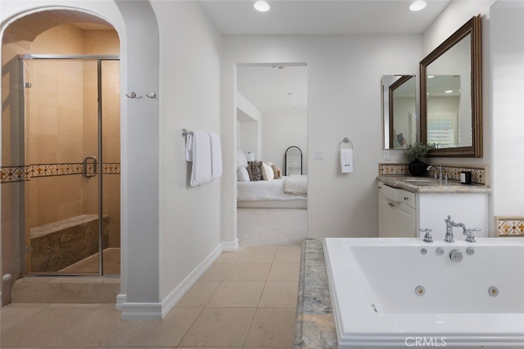 26 Via Fontibre San Clemente, CA 92673 - Photo 37 of 52 a bathroom with a tub sink and mirror