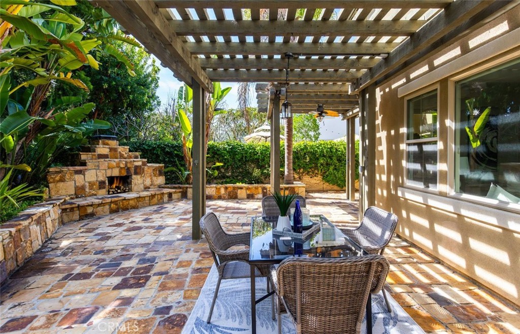 26 Via Fontibre San Clemente, CA 92673 - Photo 40 of 52 a view of a patio with table and chairs and floor to ceiling window