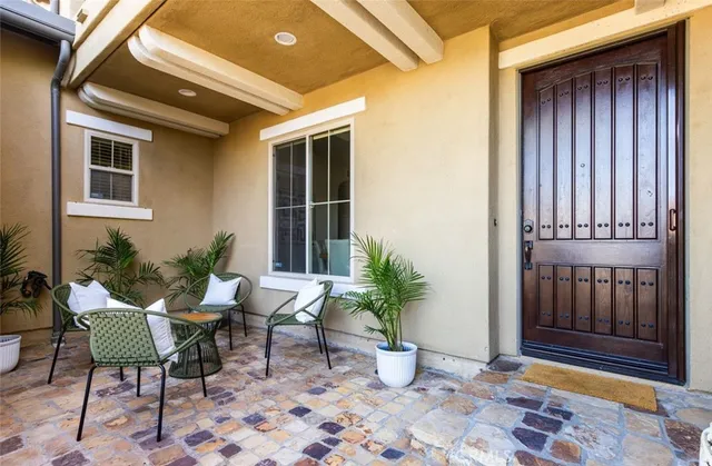 a view of a house with porch and sitting area