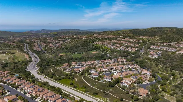 an aerial view of residential building with green space
