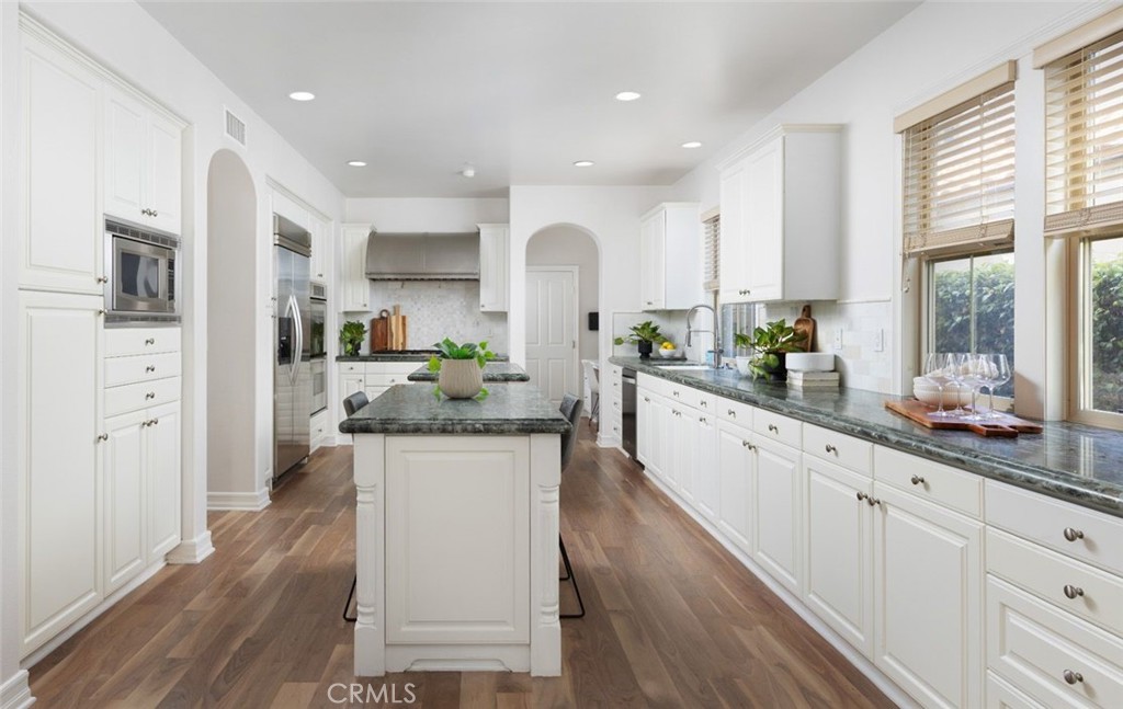 26 Via Fontibre San Clemente, CA 92673 - Photo 10 of 52 a large kitchen with granite countertop a large counter top appliances and cabinets