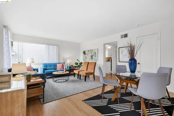 a living room with furniture or couch and a lamp