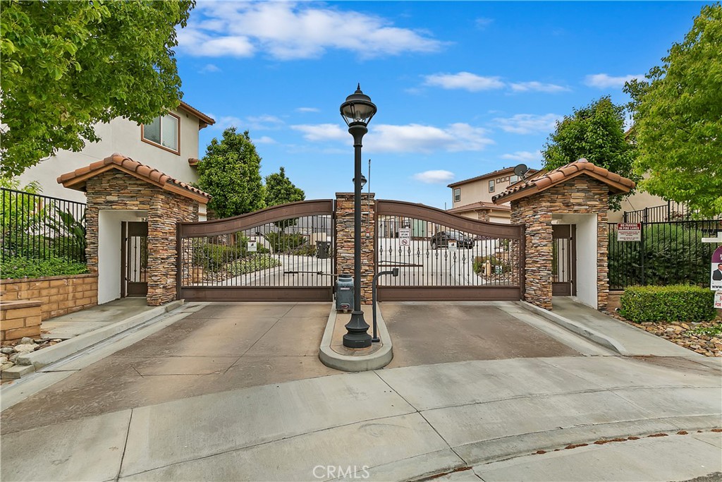 569 Vía Pueblo Riverside, CA 92507 - Photo 1 of 1 a front view of a building with parking space and plants