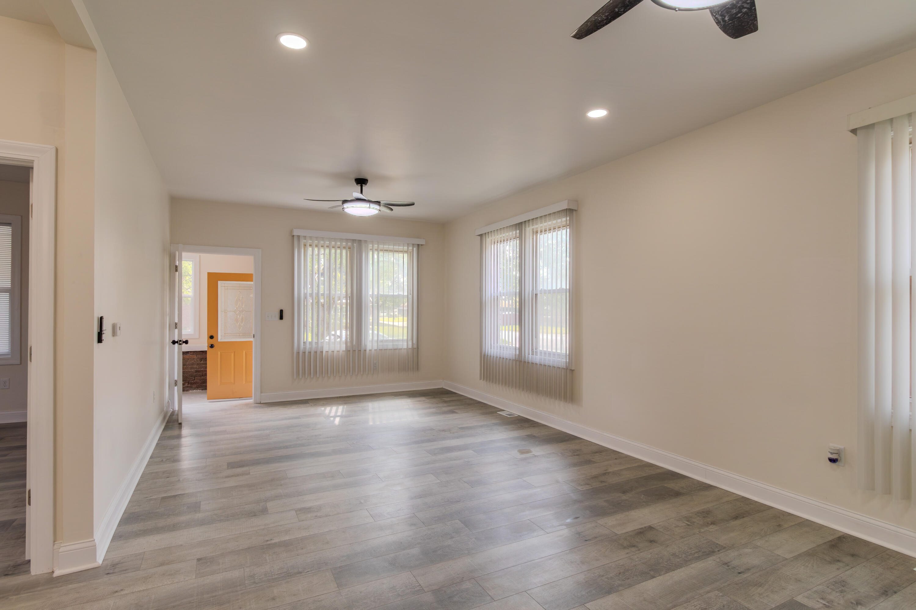 3678 Jackson Street Gary, IN 46408 - Photo 6 of 27 wooden floor in an empty room with a window