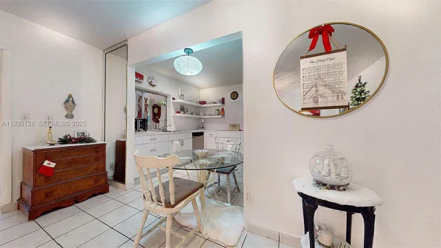 a bed room with a bed mirror and a chandelier