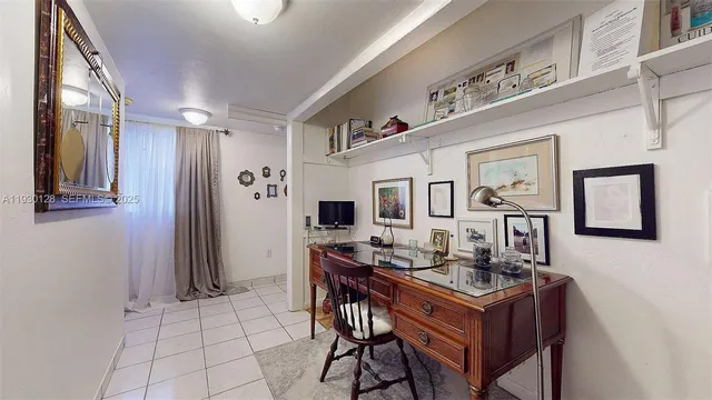 a room with pool table and windows