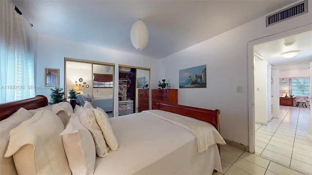 a room with pool table and windows