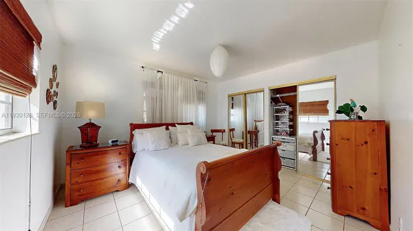 a view of a a dining room with furniture window and wooden floor