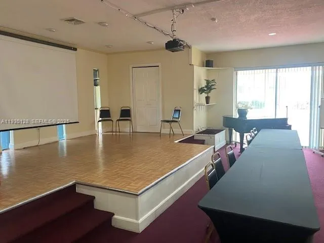 a view of swimming pool with a yard