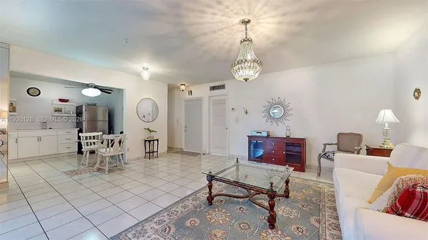 a kitchen with a refrigerator sink and cabinets