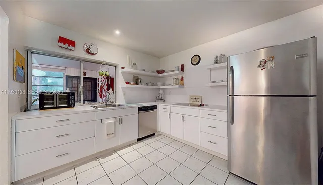 a view of a workspace with furniture
