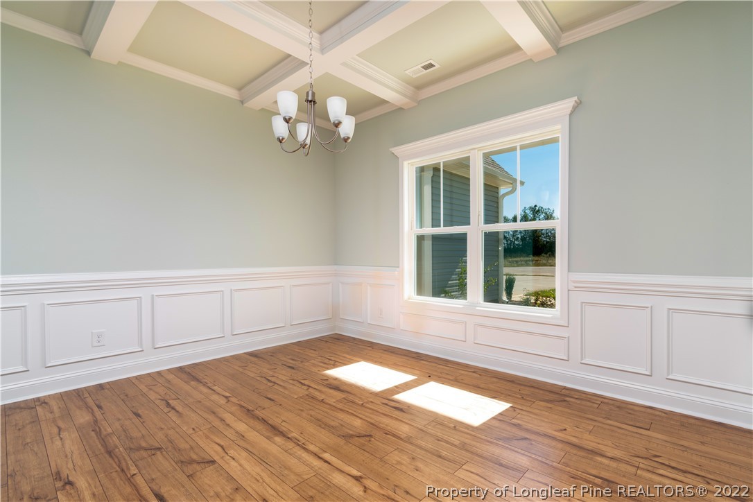 5229 Bree Bridge Road Hope Mills, NC 28348 - Photo 4 of 18 wooden floor in an empty room with a window