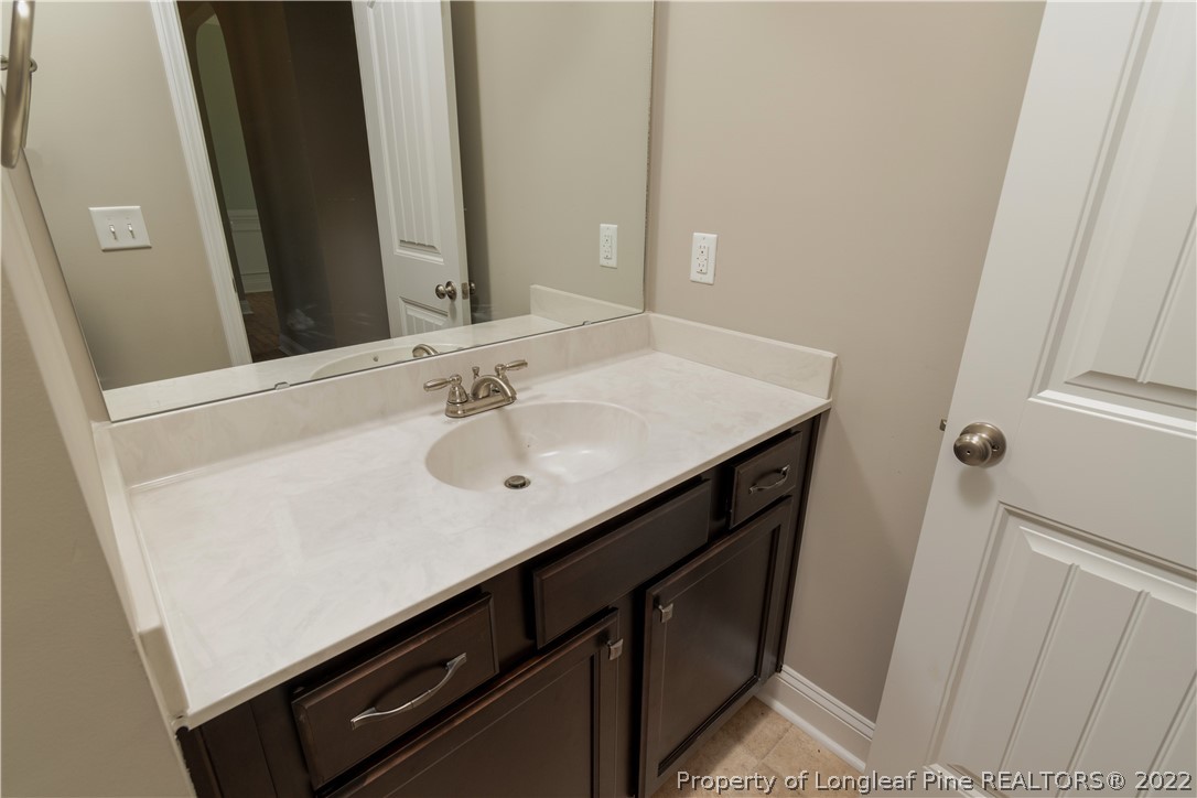 5229 Bree Bridge Road Hope Mills, NC 28348 - Photo 6 of 18 a bathroom with a sink and a mirror