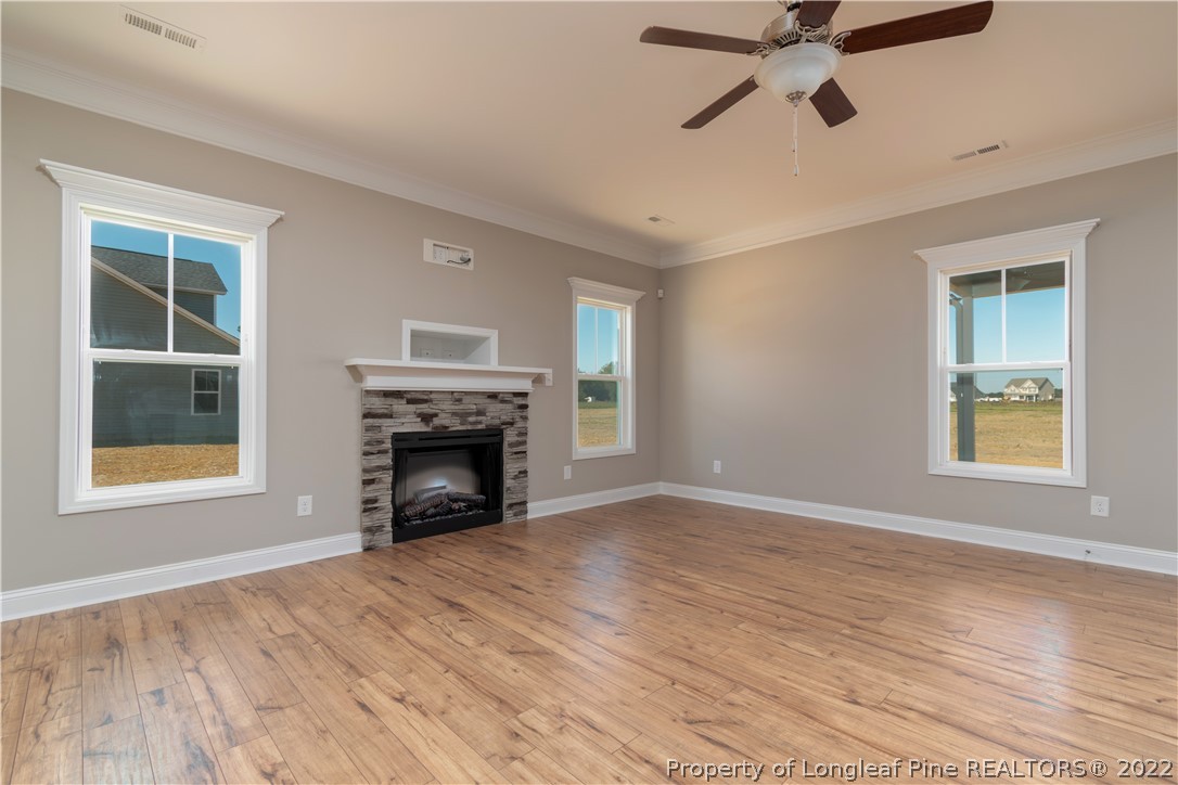 5229 Bree Bridge Road Hope Mills, NC 28348 - Photo 8 of 18 a view of an empty room with window and fire place
