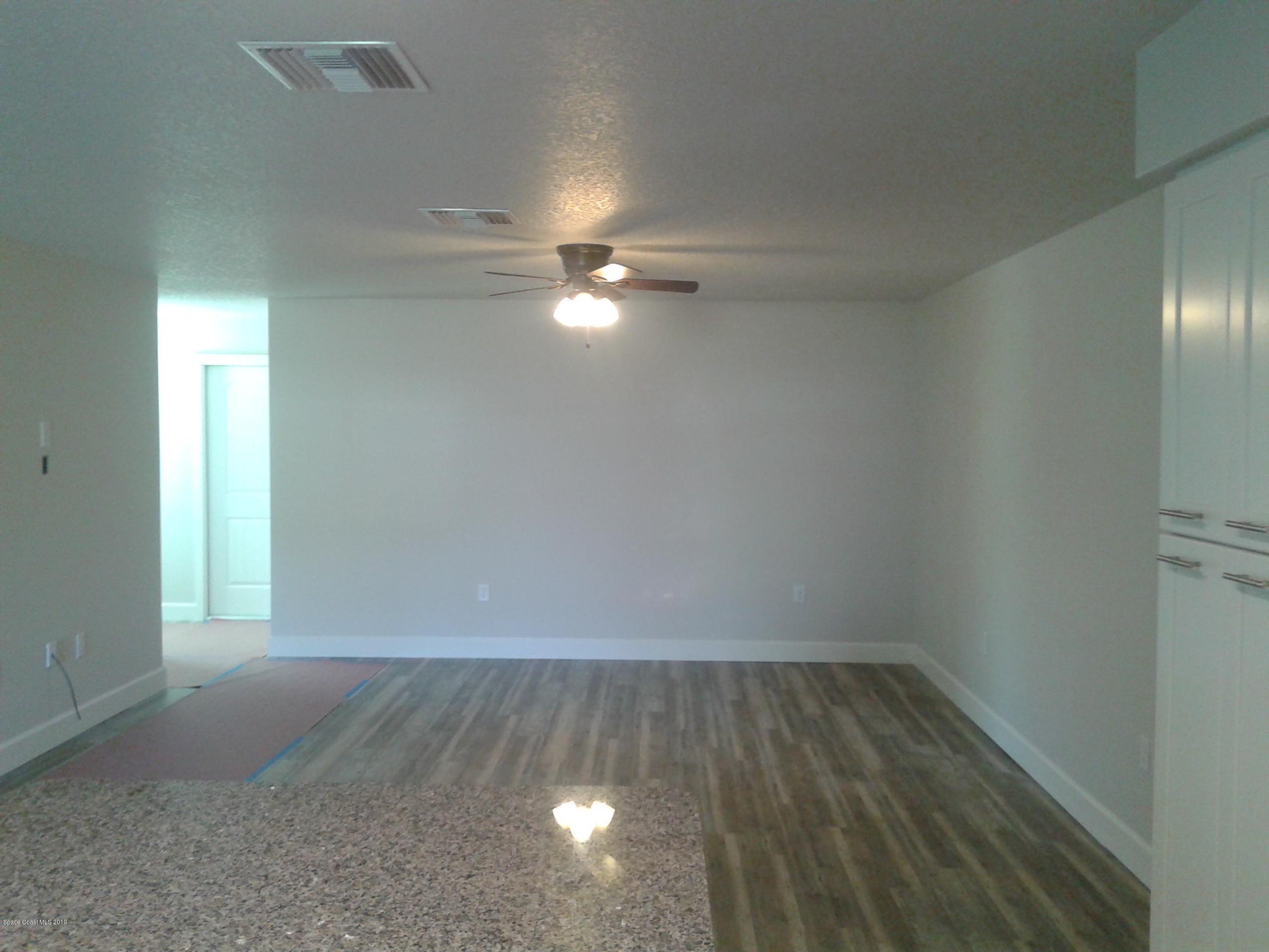1851 Keewin Avenue, Unit 2 Palm Bay, FL 32905 - Photo 7 of 15 wooden floor in an empty room