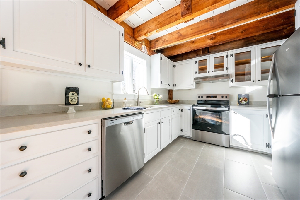 80 Branch Terrace Barnstable, MA 02648 - Photo 13 of 38 a kitchen with granite countertop white cabinets and white appliances