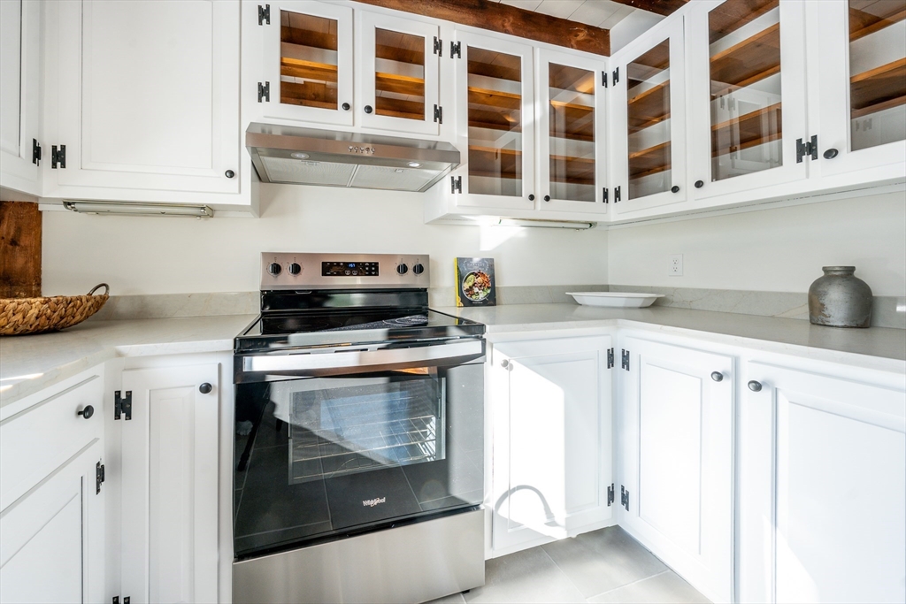 80 Branch Terrace Barnstable, MA 02648 - Photo 14 of 38 a kitchen with a stove and a white cabinet