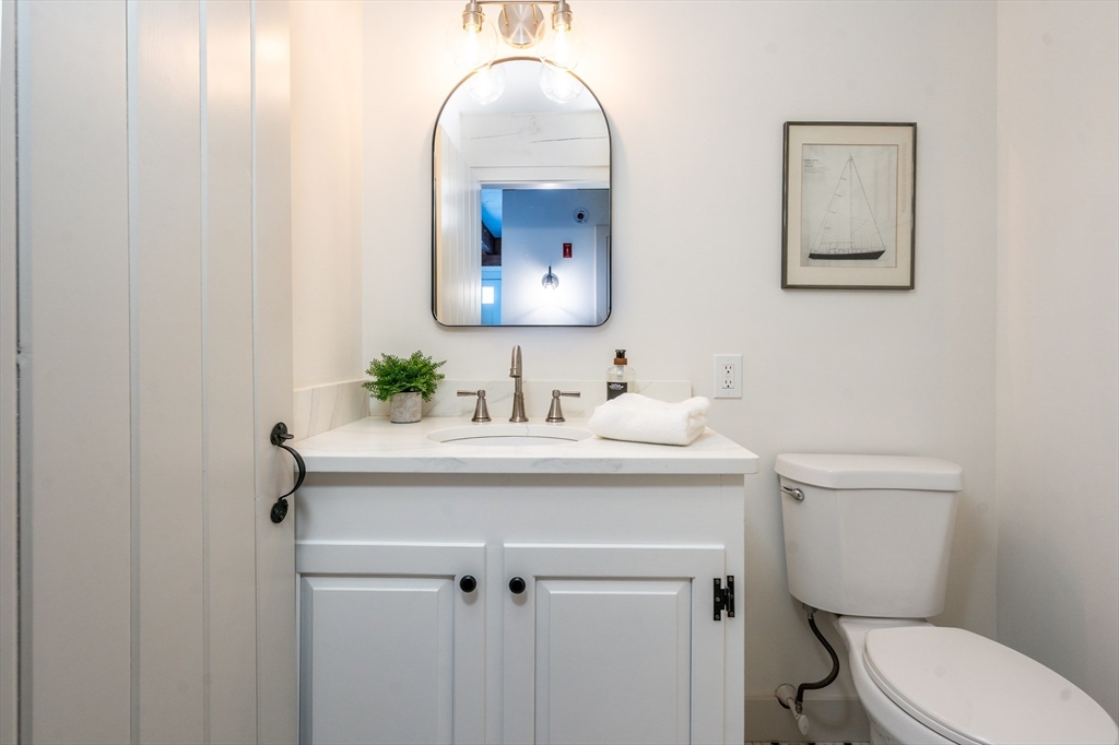 80 Branch Terrace Barnstable, MA 02648 - Photo 15 of 38 a bathroom with a sink mirror and toilet