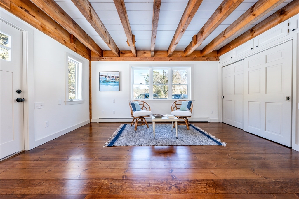 80 Branch Terrace Barnstable, MA 02648 - Photo 17 of 38 a living room with furniture a wooden floor and window