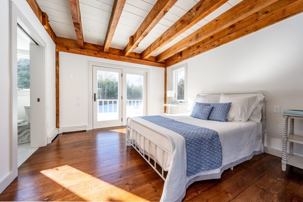 80 Branch Terrace Barnstable, MA 02648 - Photo 21 of 38 a spacious bedroom with a bed and wooden floor