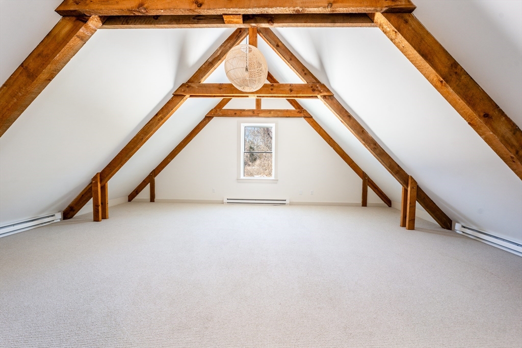 80 Branch Terrace Barnstable, MA 02648 - Photo 25 of 38 an empty room with wooden floor and windows