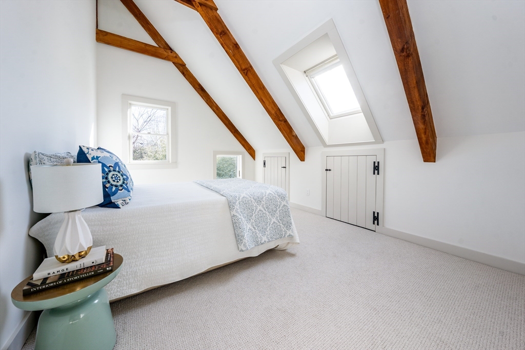 80 Branch Terrace Barnstable, MA 02648 - Photo 28 of 38 a bedroom with a bed and a chair