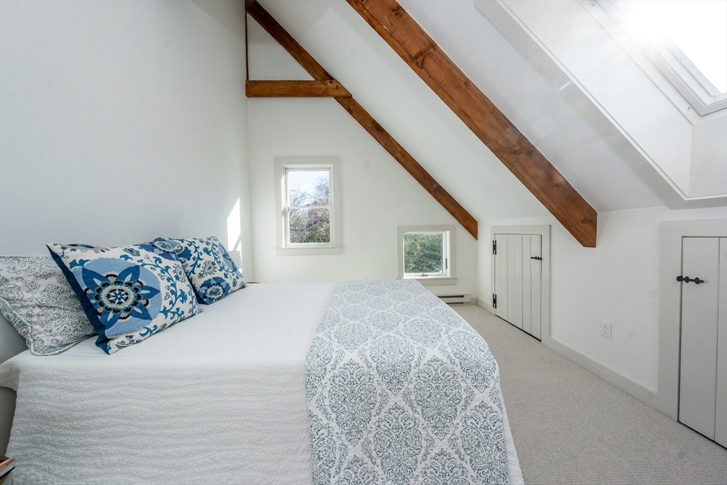 80 Branch Terrace Barnstable, MA 02648 - Photo 29 of 38 a bed sitting in a spacious bedroom next to a window