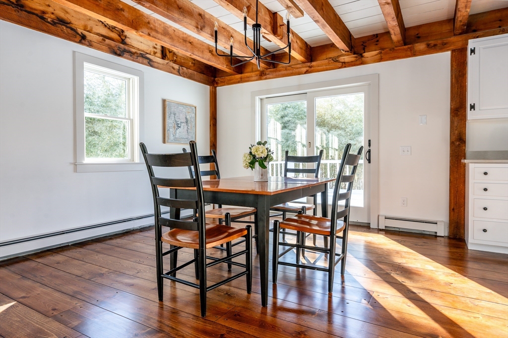 80 Branch Terrace Barnstable, MA 02648 - Photo 8 of 38 a view of a dining room with furniture window and wooden floor