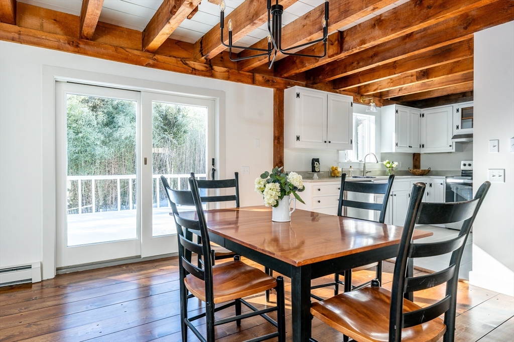 80 Branch Terrace Barnstable, MA 02648 - Photo 9 of 38 a view of a dining room with furniture window and wooden floor