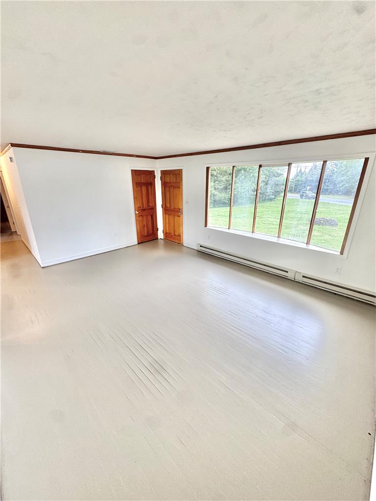 8325 Schantz Road Breinigsville, PA 18031 - Photo 5 of 21 A luminous living space features broad windows that frame pastoral green views.