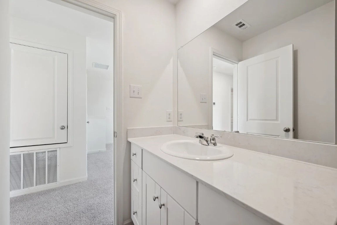 1109 Delta Crest Maxwell, TX 78656 - Photo 12 of 21 a bathroom with a sink and a mirror