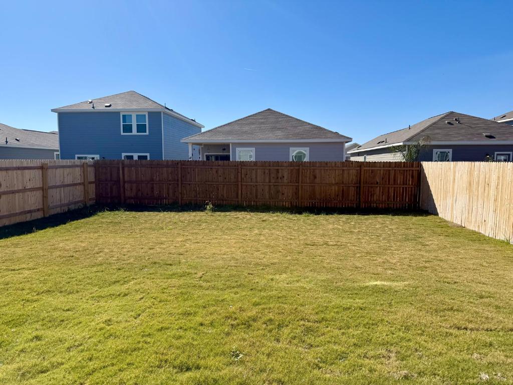 1109 Delta Crest Maxwell, TX 78656 - Photo 20 of 21 a front view of a house having yard